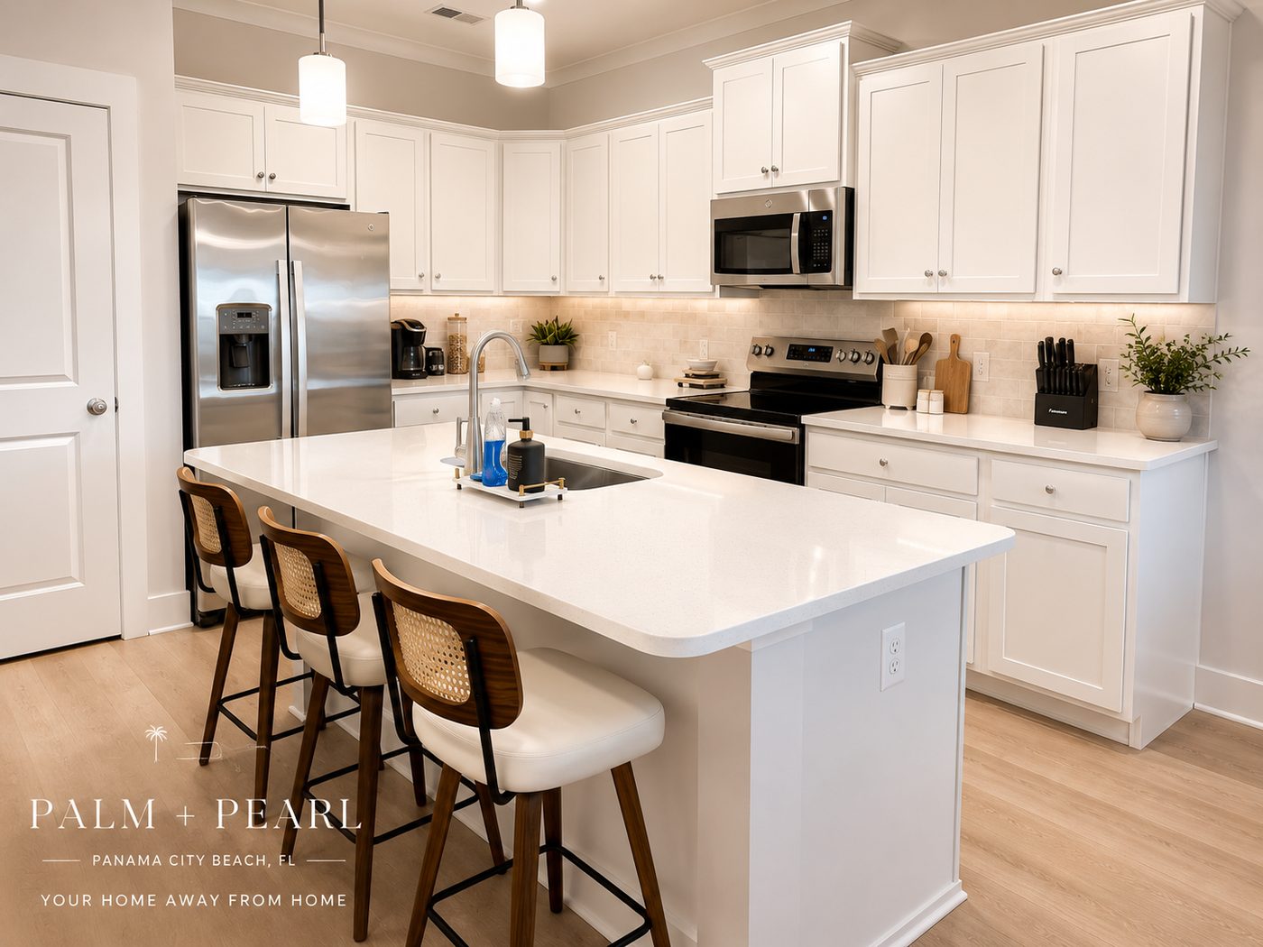 Open kitchen with quartz island and bar seating